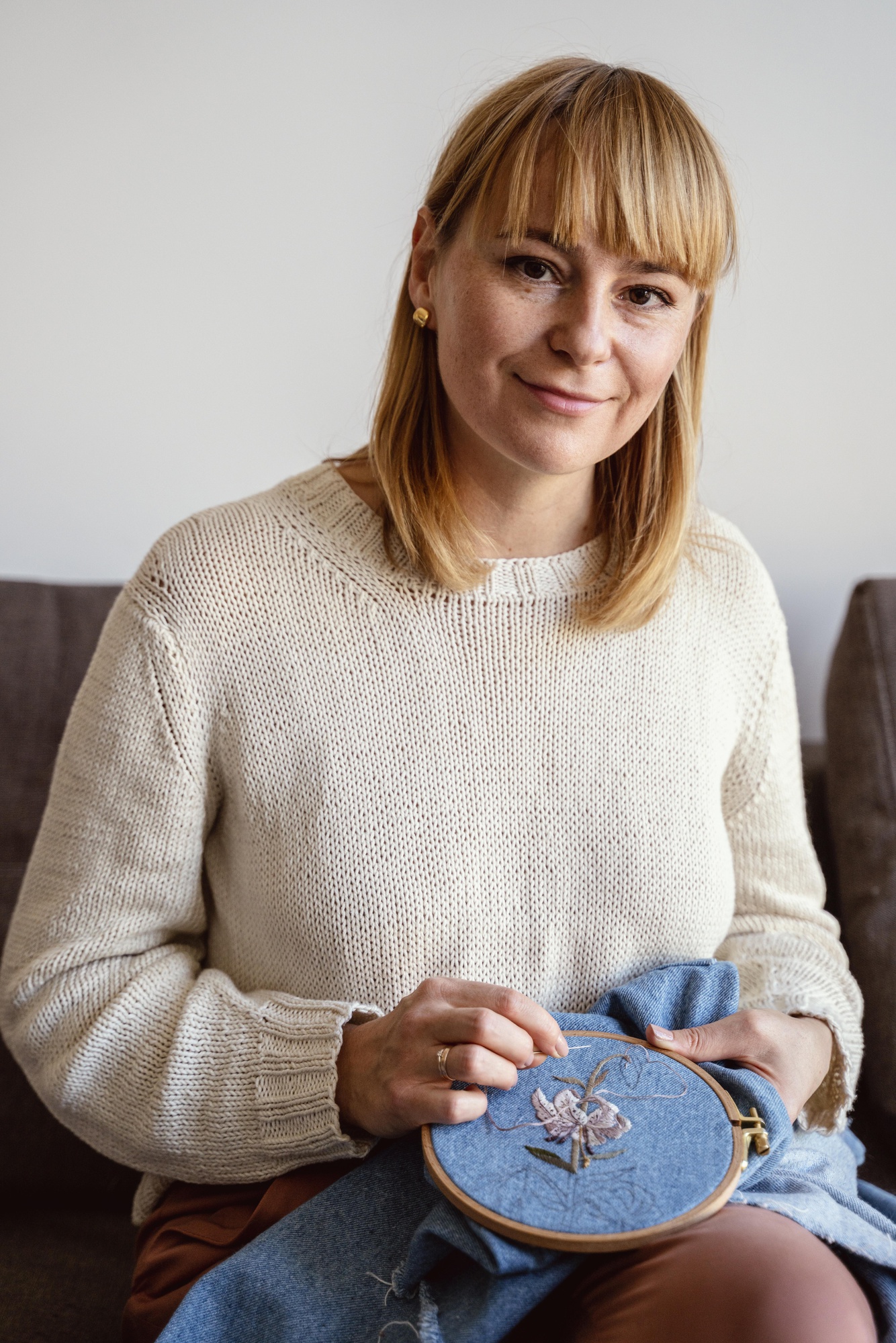 portrait of founder stitching